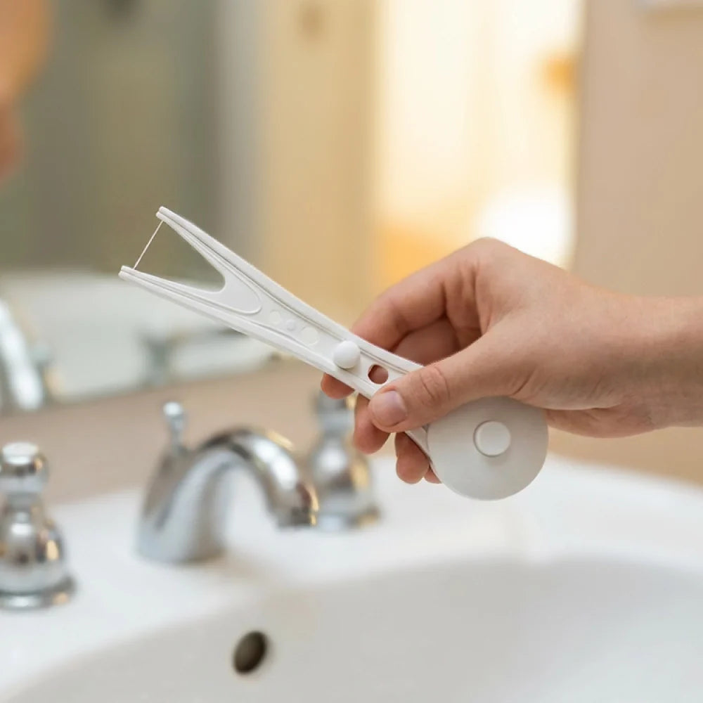 The reusable dental flosser